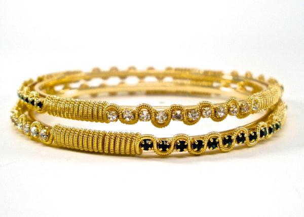 gold bangles with white and green stones