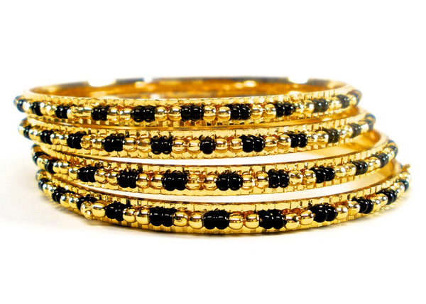 thin gold bangles with black and gold beads