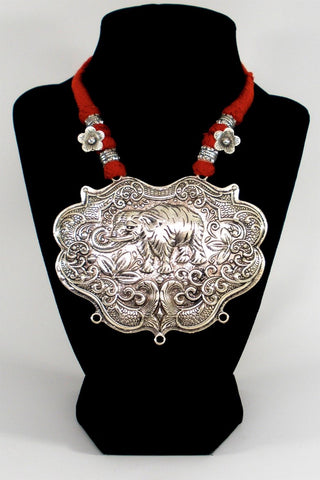grand oxidized pendant in red ethnic thread