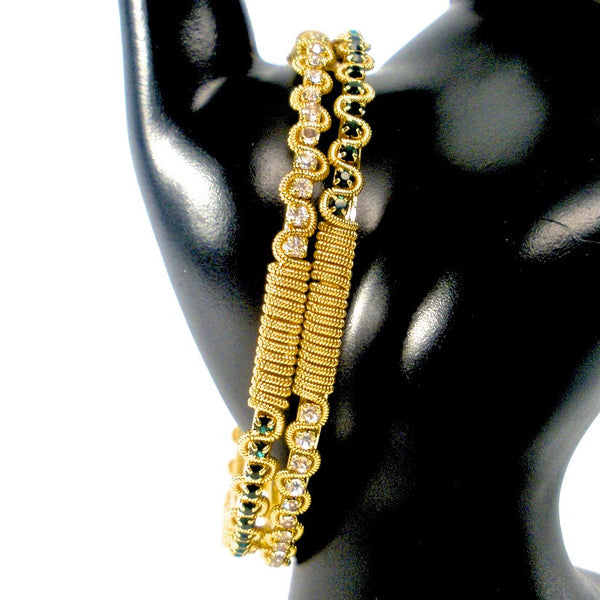 gold bangles with white and green stones