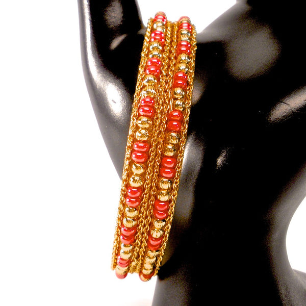 pair of gold bangles with beads