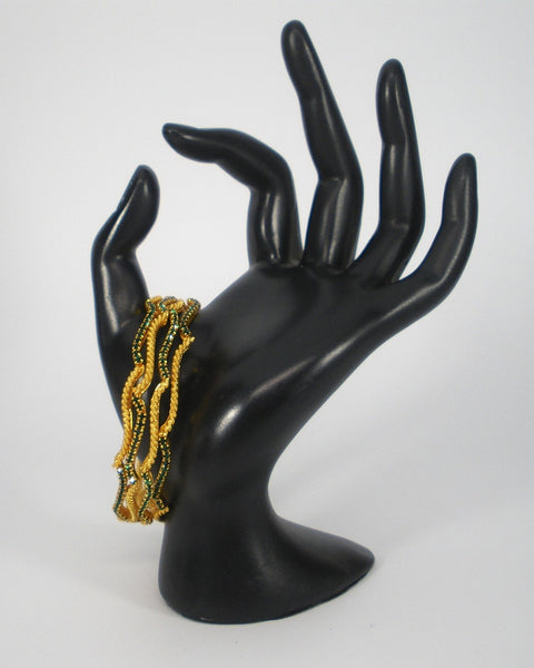 wavy bangles with colored stones