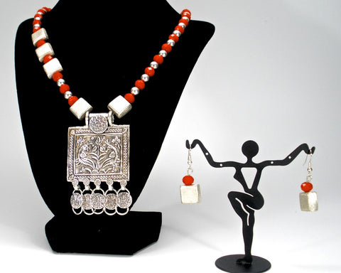 orange crystals with tribal pendant and square silver spacers
