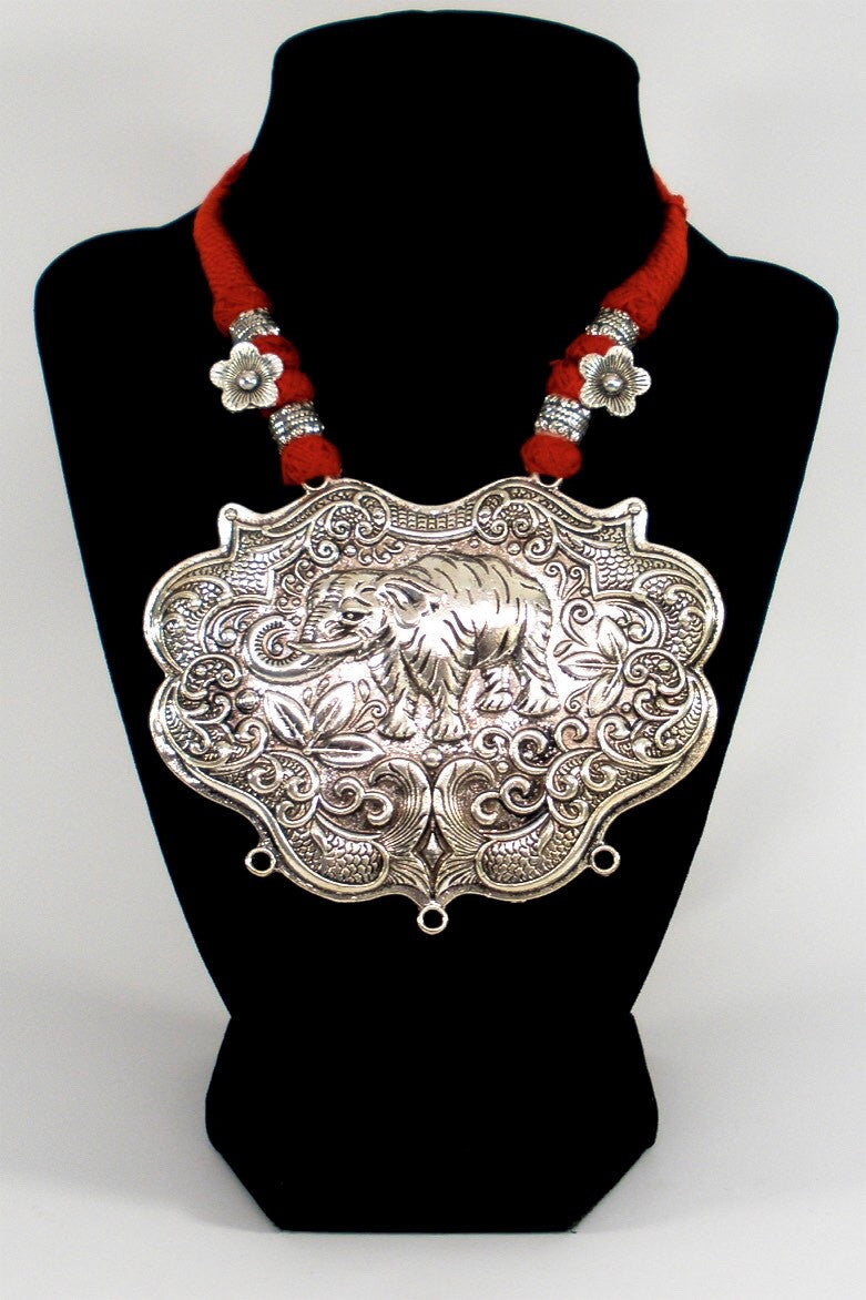 grand oxidized pendant in red ethnic thread